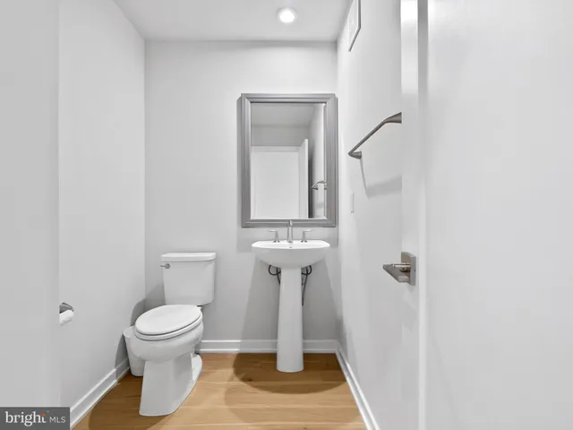 a bathroom with a toilet and a sink