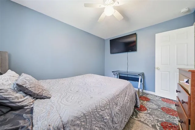 a bedroom with a bed and a dresser