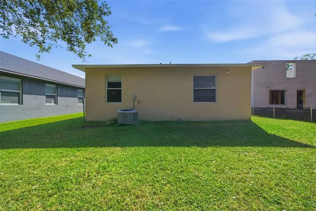 a view of a tree in a yard
