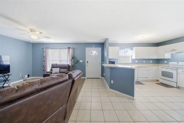 a large bedroom with a bed and lots of cabinets