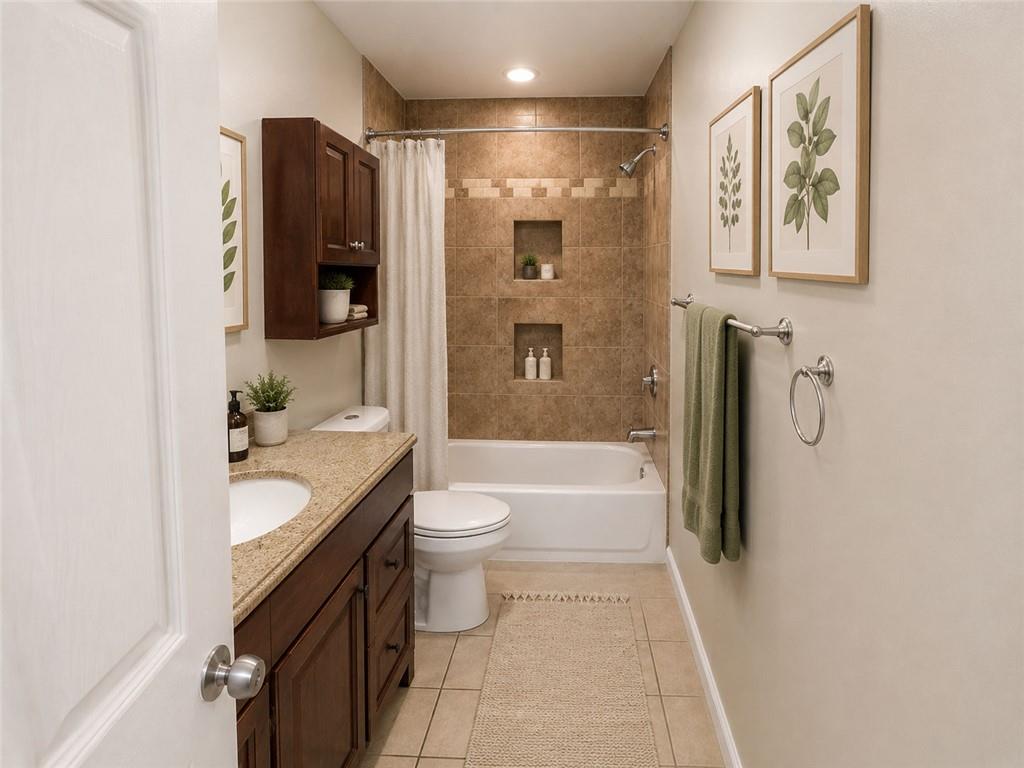 1280 Elizabeth Avenue Southwest Atlanta, GA 30310 - Photo 7 of 11 a bathroom with a granite countertop bathtub shower sink vanity and toilet