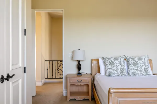 a bedroom with a bed and a couch
