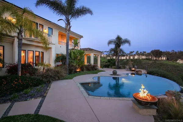 a view of a swimming pool with a patio