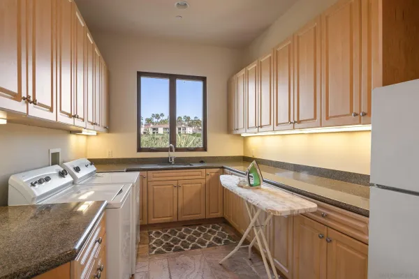 a kitchen with a sink stove and window