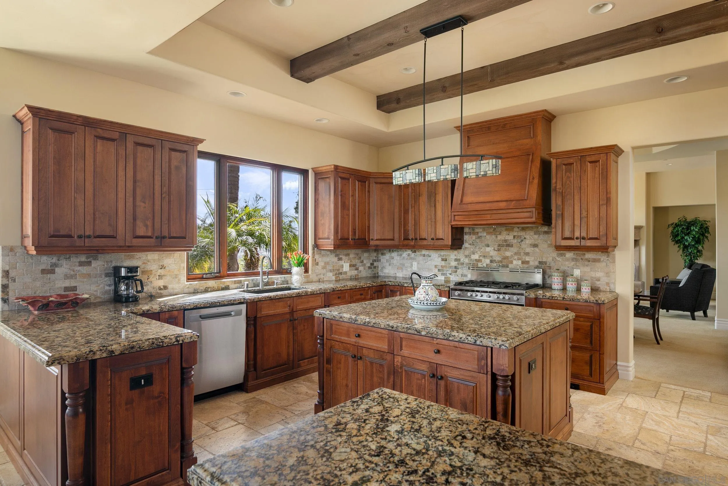 2922 Managua Place Carlsbad, CA 92009 - Photo 8 of 45 a kitchen with a sink stove and cabinets