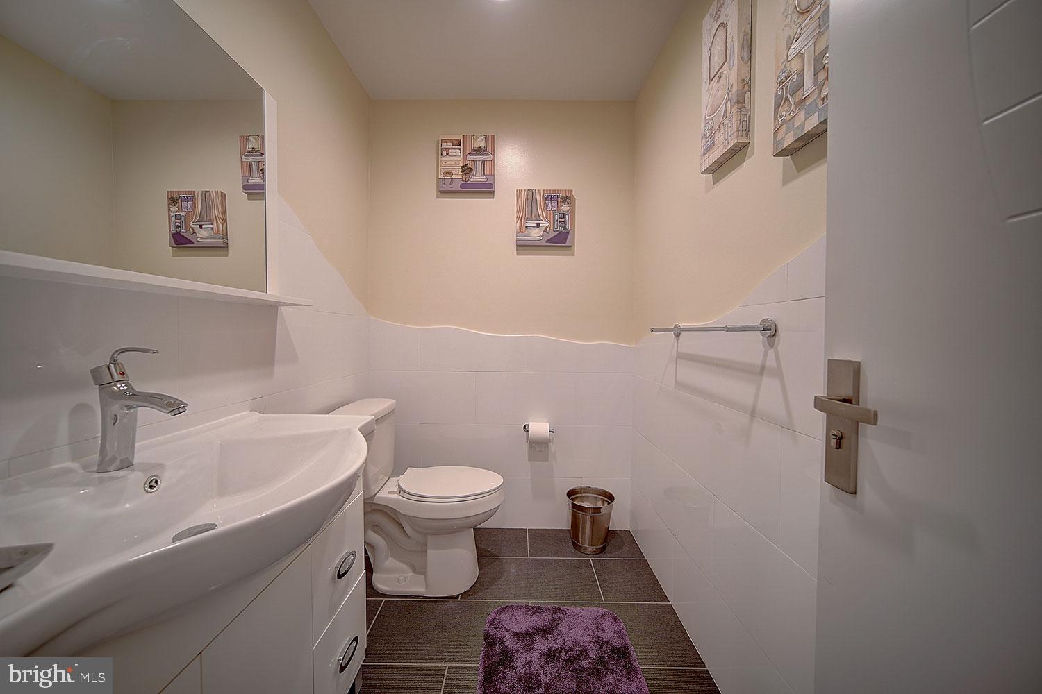 800 North 48th Street, Unit 38 Philadelphia, PA 19139 - Photo 12 of 18 a bathroom with a sink and a toilet