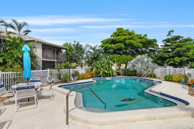 a view of a swimming pool with a lounge chairs