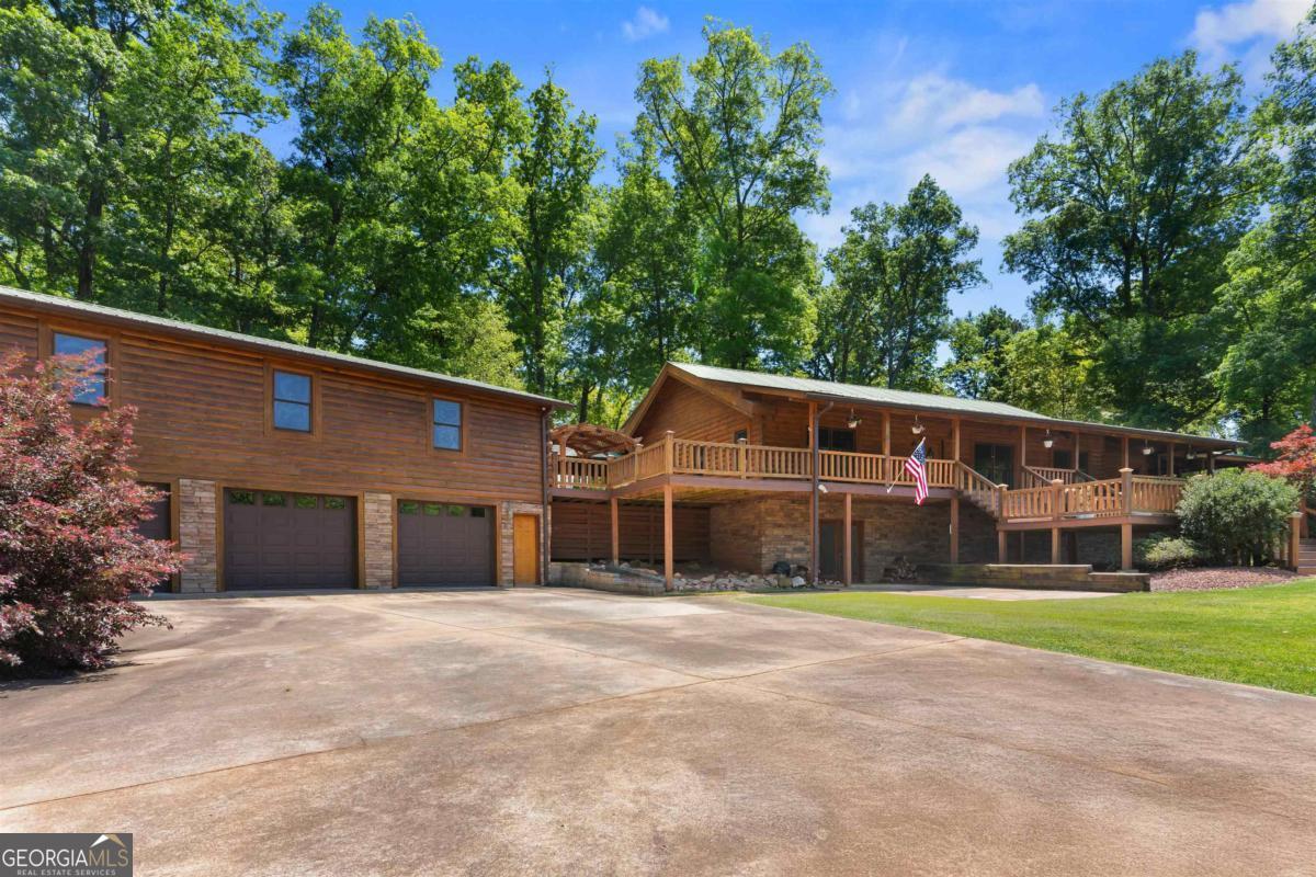 224 Harmony Road Eatonton, GA 31024 - Photo 1 of 68 front view of a house with a street