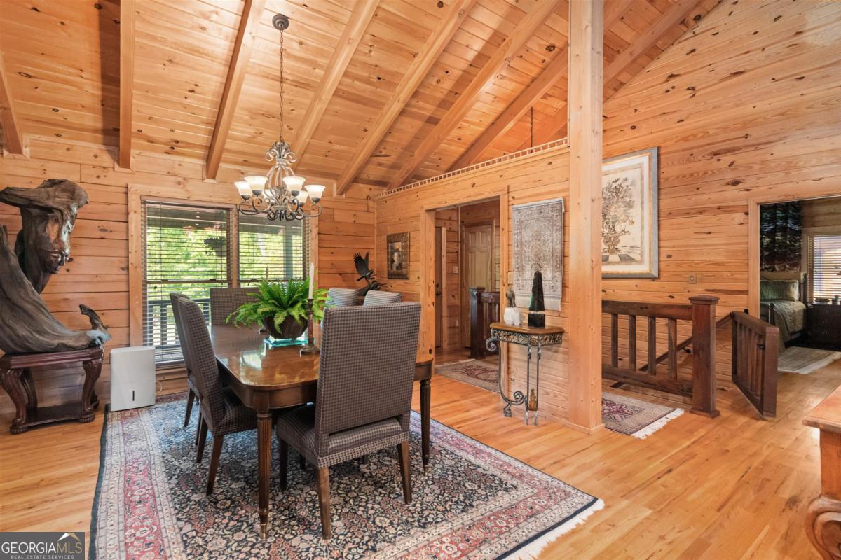 224 Harmony Road Eatonton, GA 31024 - Photo 13 of 68 a view of a dining room with furniture window and wooden floor