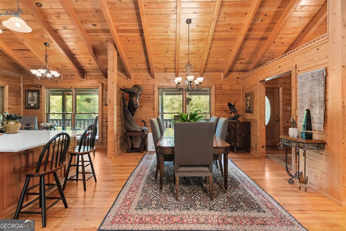 224 Harmony Road Eatonton, GA 31024 - Photo 14 of 68 a view of a dining room with furniture window and wooden floor