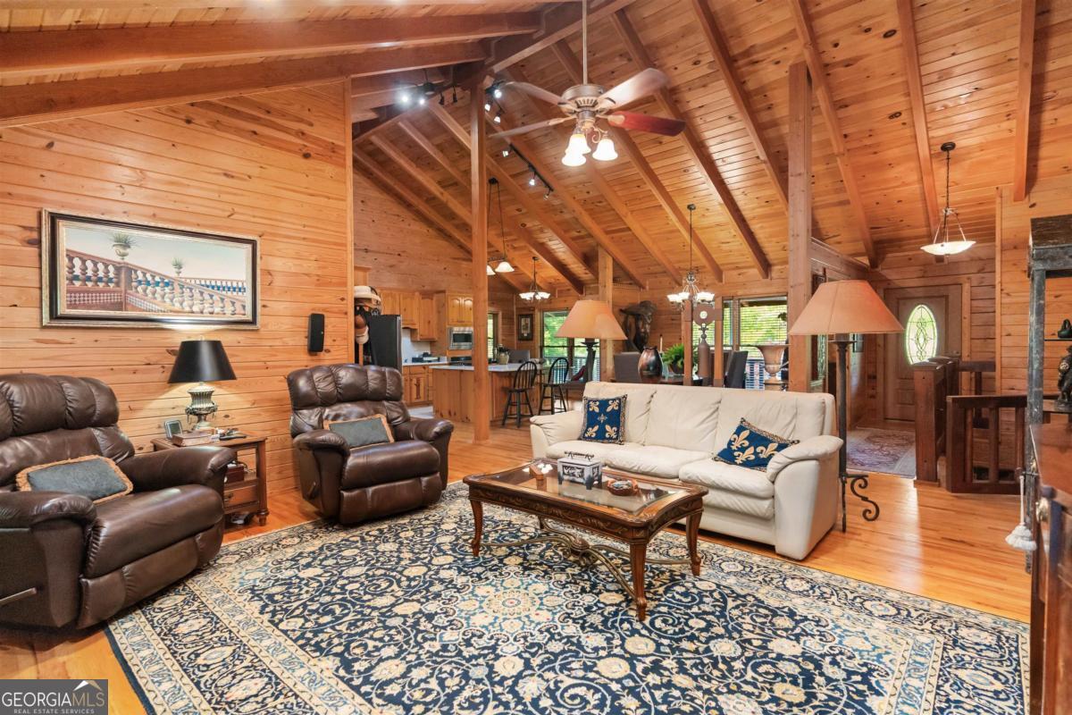 224 Harmony Road Eatonton, GA 31024 - Photo 20 of 68 a living room with furniture and a rug