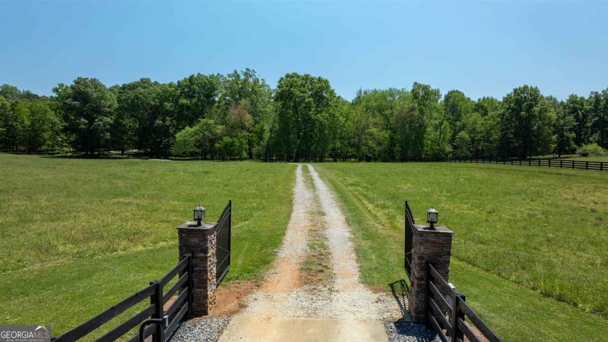 224 Harmony Road Eatonton, GA 31024 - Photo 2 of 68 a view of a lake with outdoor space