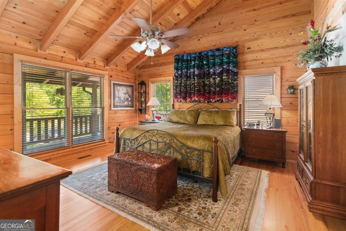 224 Harmony Road Eatonton, GA 31024 - Photo 22 of 68 a bed sitting in a bedroom next to a window