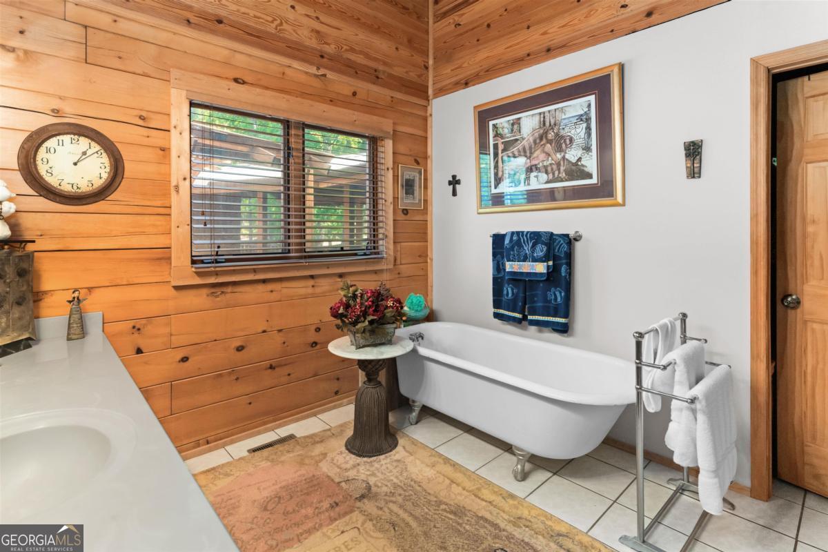224 Harmony Road Eatonton, GA 31024 - Photo 23 of 68 a bathroom with a sink and a bathtub