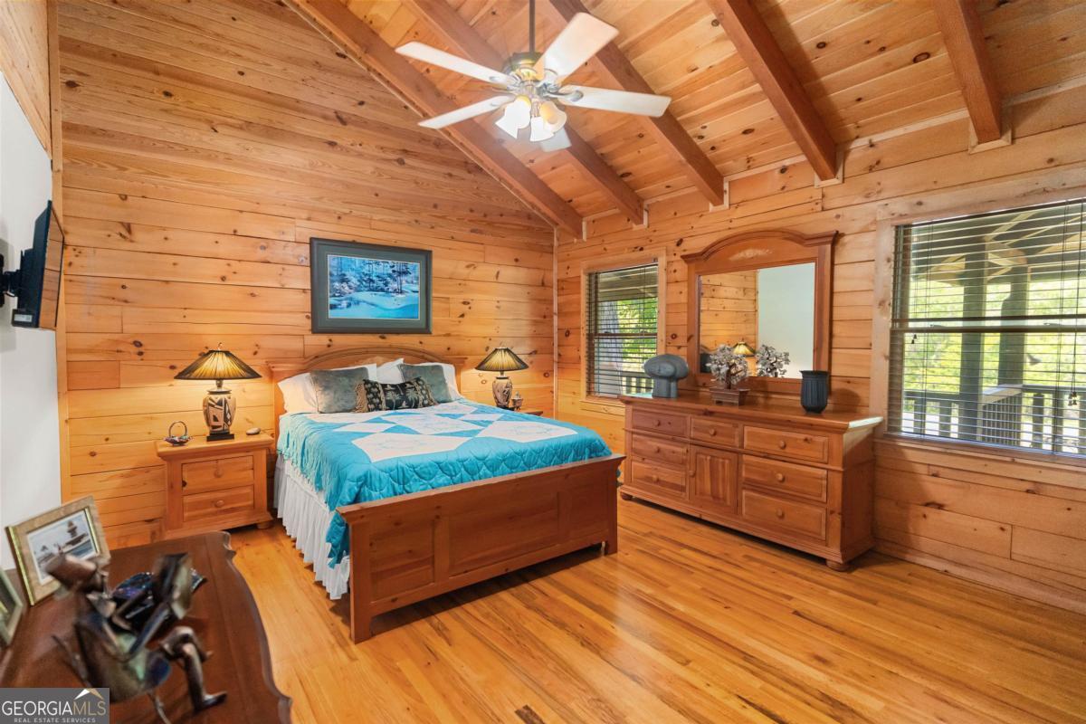 224 Harmony Road Eatonton, GA 31024 - Photo 29 of 68 a bed room with a bed and a large window