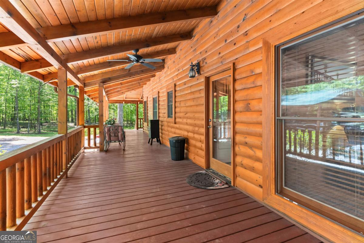 224 Harmony Road Eatonton, GA 31024 - Photo 33 of 68 a view of a porch with wooden floor