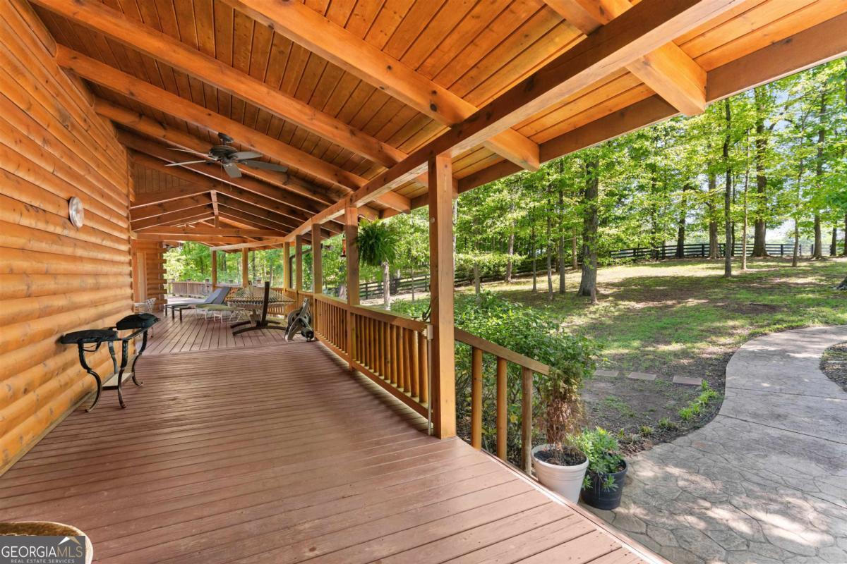 224 Harmony Road Eatonton, GA 31024 - Photo 34 of 68 a view of a patio with wooden floor