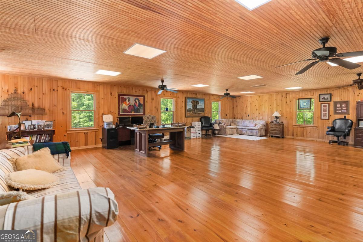 224 Harmony Road Eatonton, GA 31024 - Photo 38 of 68 a living room with furniture and kitchen view