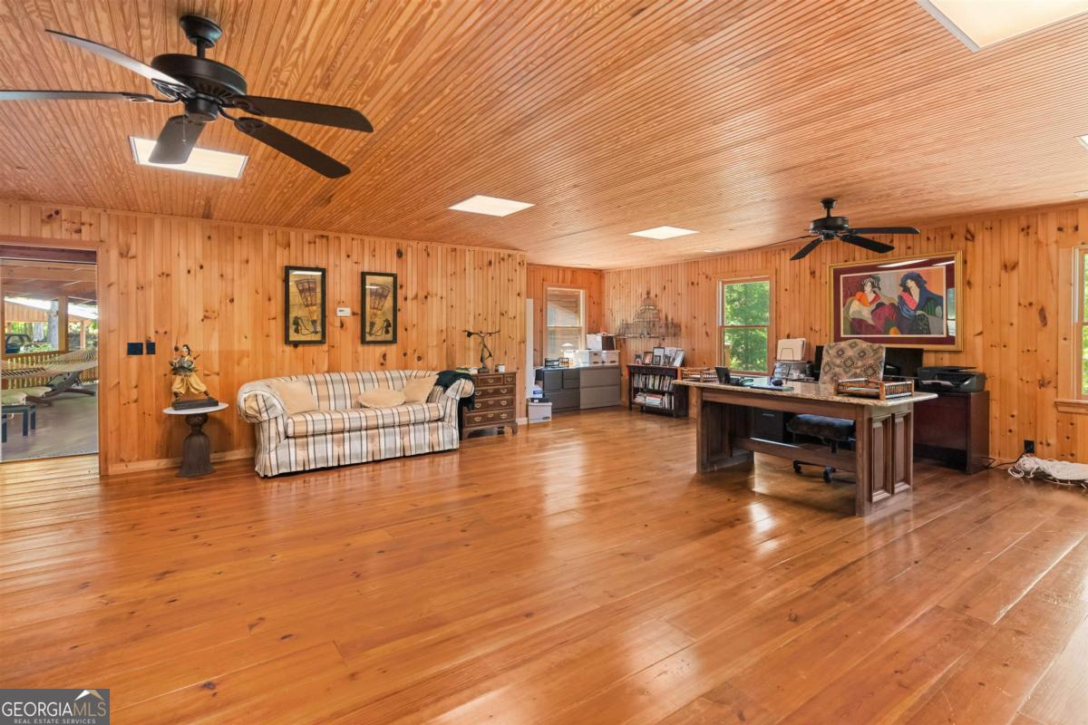 224 Harmony Road Eatonton, GA 31024 - Photo 39 of 68 a living room with furniture and kitchen view