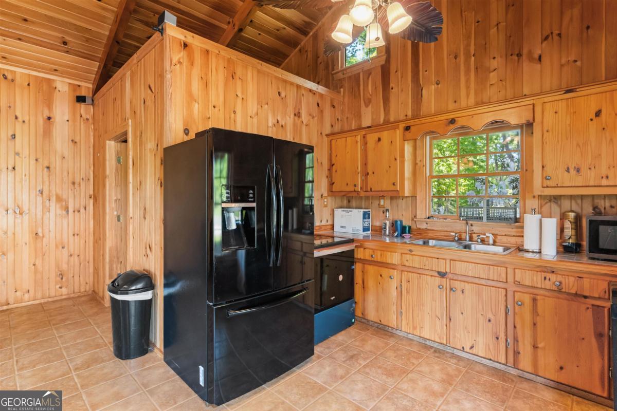 224 Harmony Road Eatonton, GA 31024 - Photo 47 of 68 a kitchen with stainless steel appliances a refrigerator and a sink