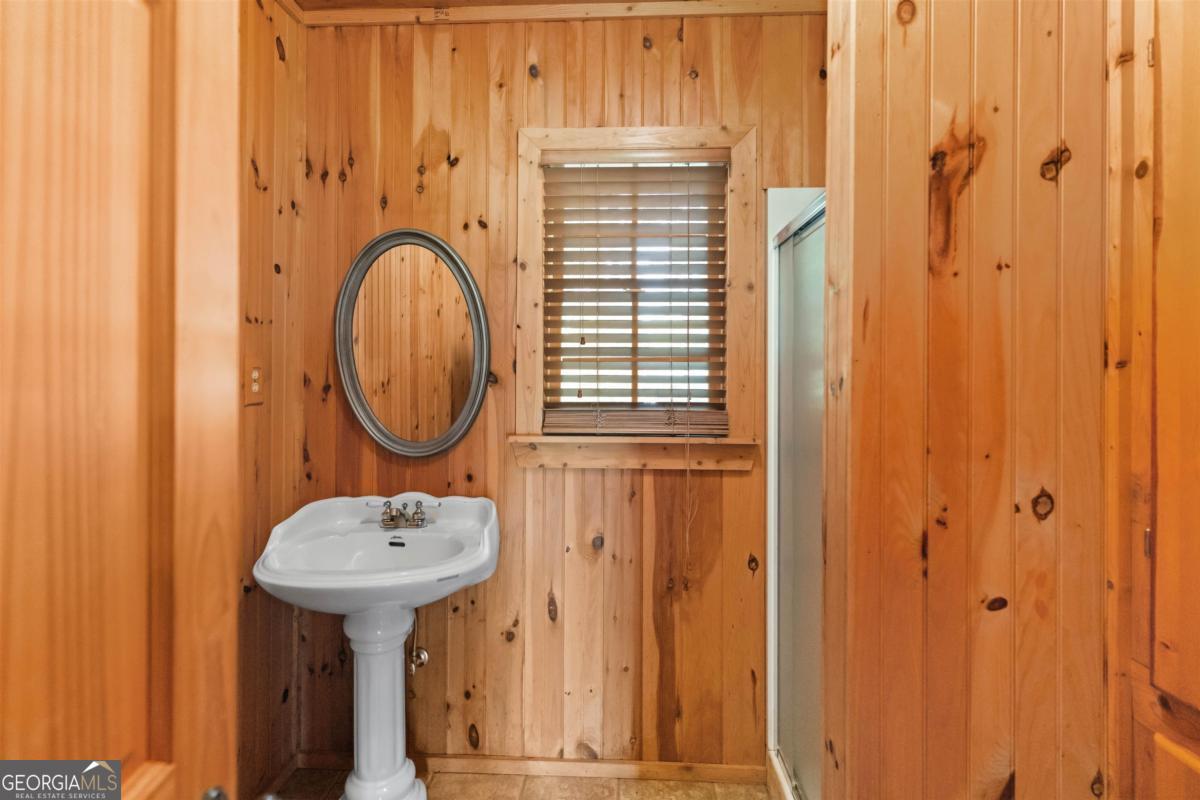224 Harmony Road Eatonton, GA 31024 - Photo 49 of 68 a bathroom with a sink and a mirror