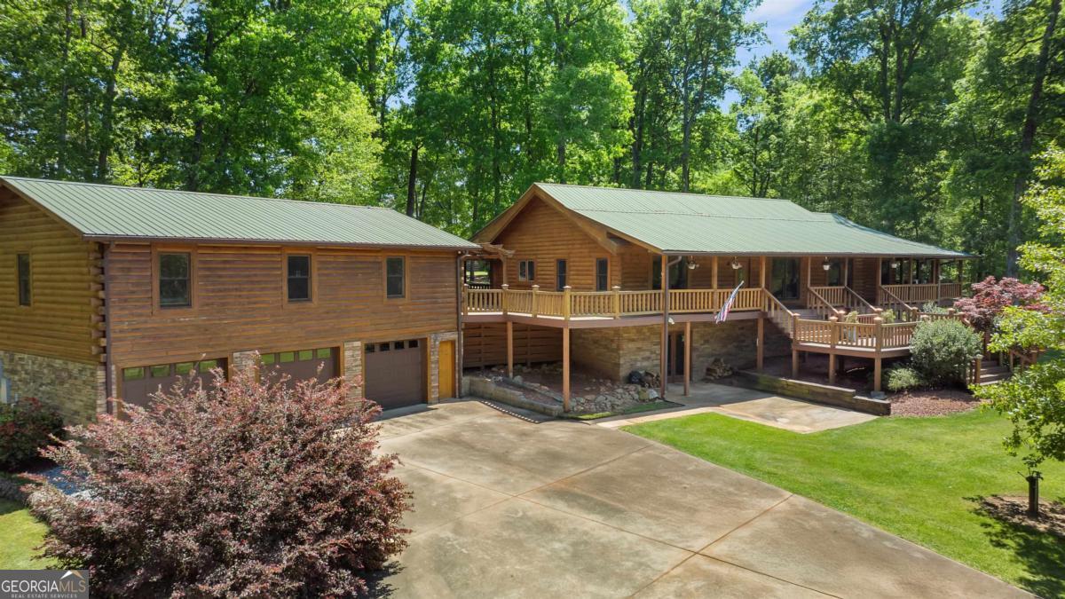 224 Harmony Road Eatonton, GA 31024 - Photo 5 of 68 front view of a house with a yard