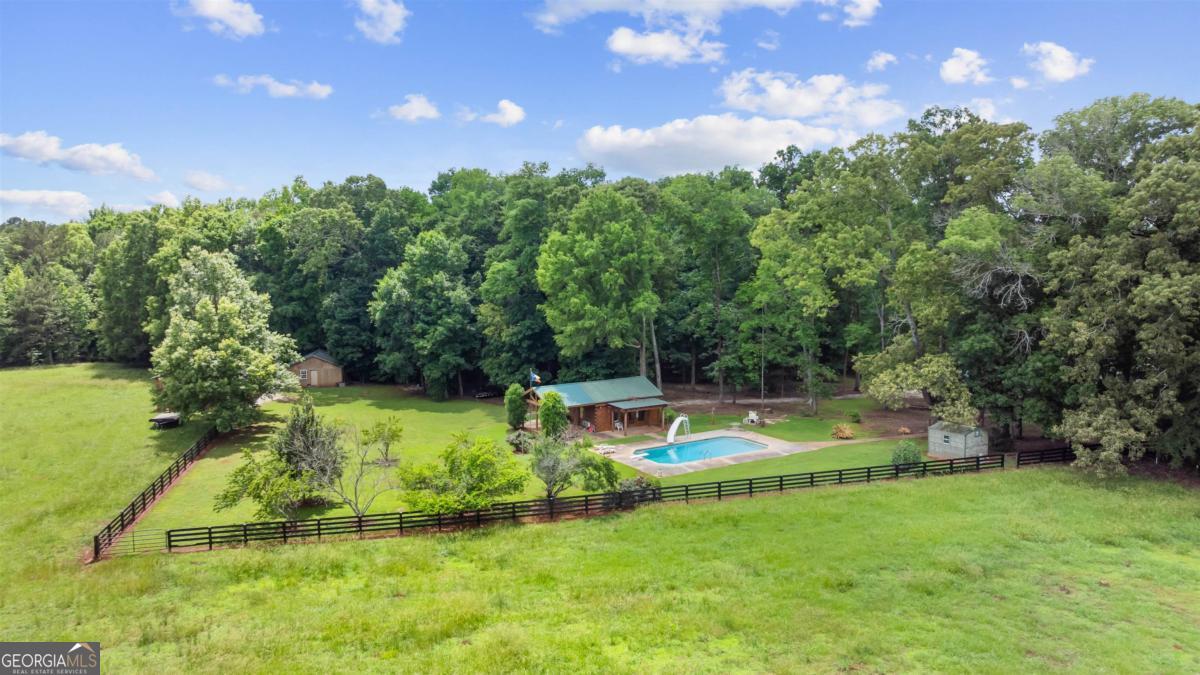 224 Harmony Road Eatonton, GA 31024 - Photo 63 of 68 a view of a golf course with a lake