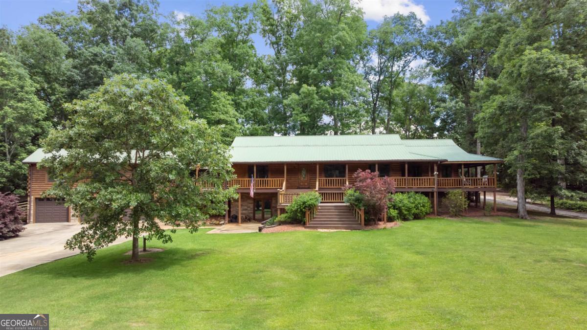 224 Harmony Road Eatonton, GA 31024 - Photo 65 of 68 a view of a yard in front of a house