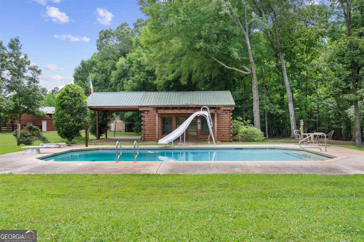 224 Harmony Road Eatonton, GA 31024 - Photo 67 of 68 a view of a house with a yard and sitting area