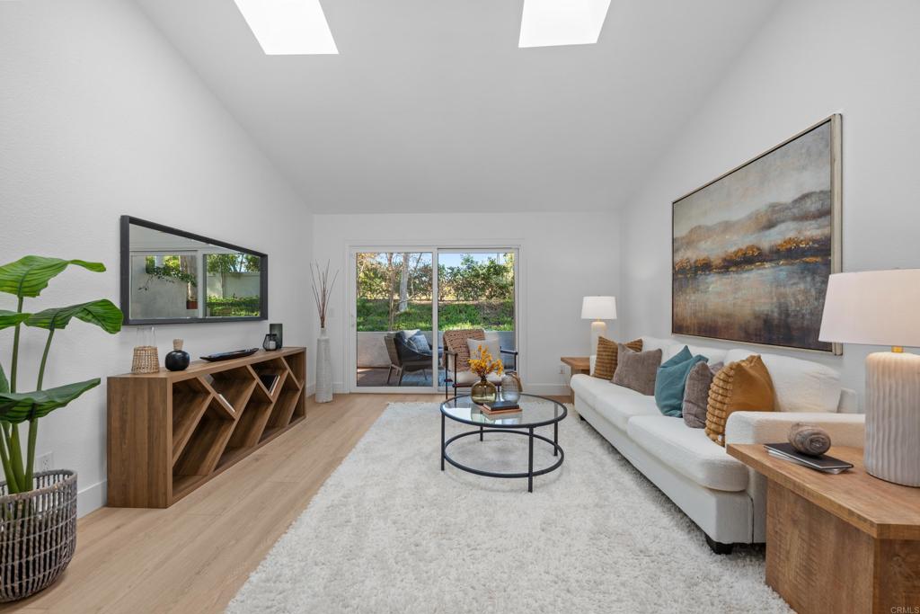 17823 Avenida Alozdra San Diego, CA 92128 - Photo 12 of 28 a living room with furniture and a flat screen tv