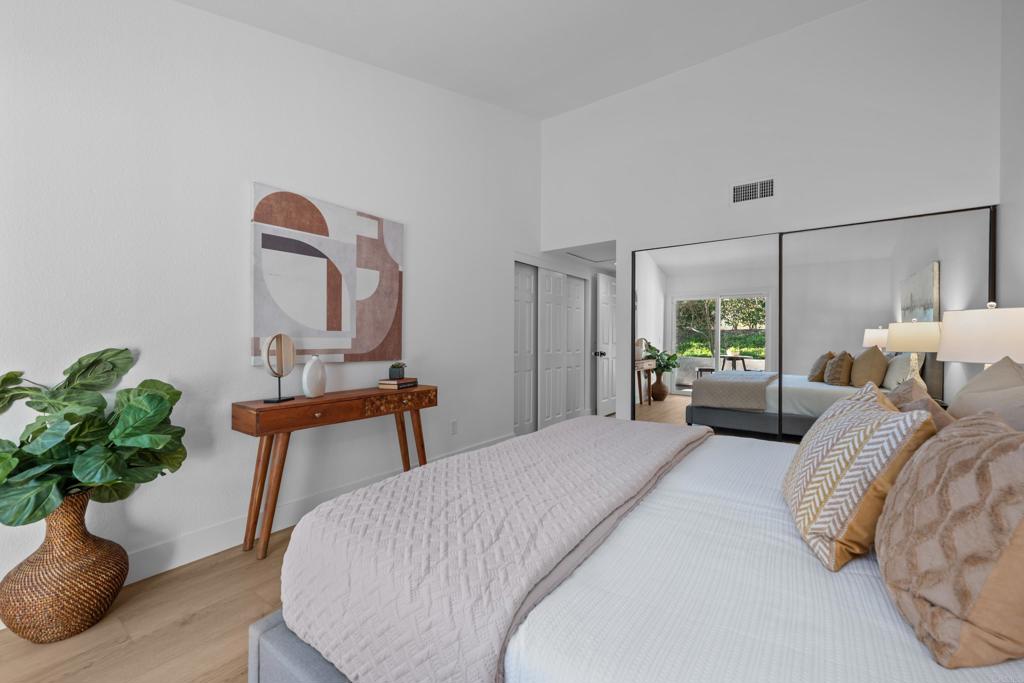 17823 Avenida Alozdra San Diego, CA 92128 - Photo 16 of 28 a bedroom with bed and a potted plant