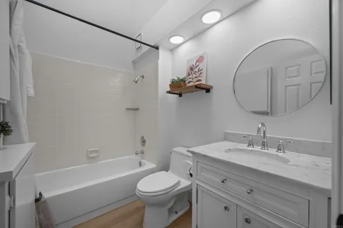 a bathroom with a sink a toilet and a bathtub