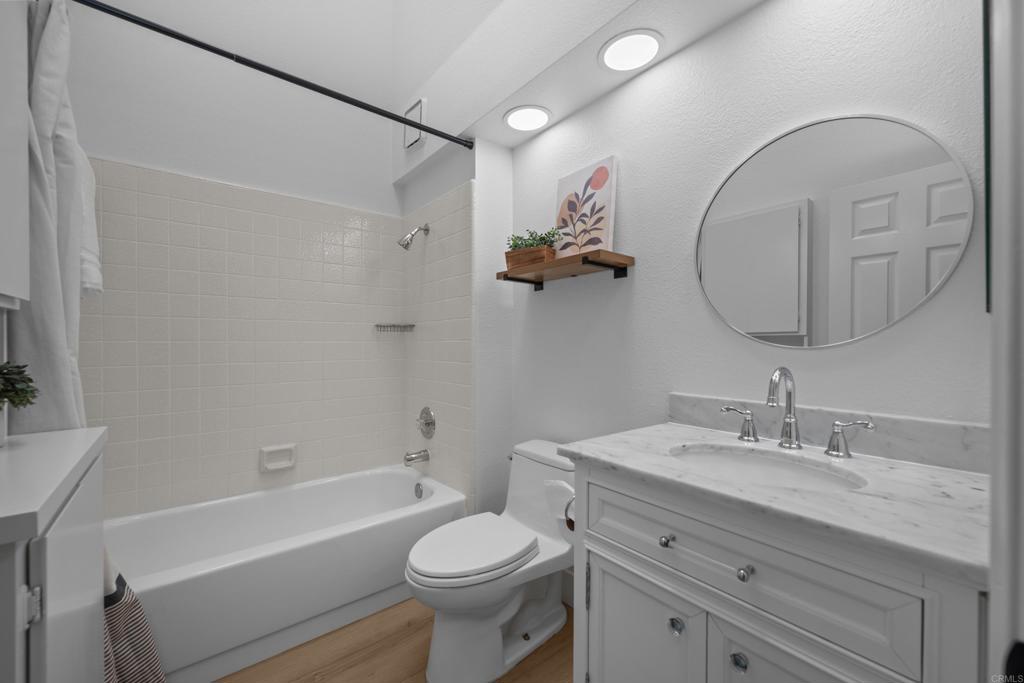 17823 Avenida Alozdra San Diego, CA 92128 - Photo 22 of 28 a bathroom with a sink a toilet and a bathtub