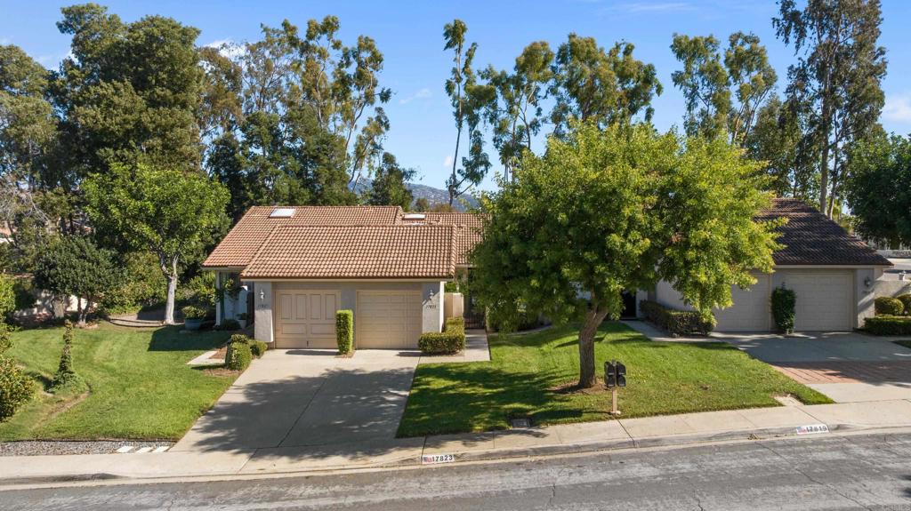17823 Avenida Alozdra San Diego, CA 92128 - Photo 3 of 28 a view of a white house with a tree and plants