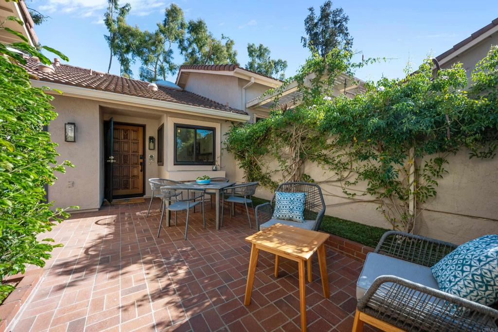 17823 Avenida Alozdra San Diego, CA 92128 - Photo 7 of 28 a view of a patio with table and chairs and potted plants