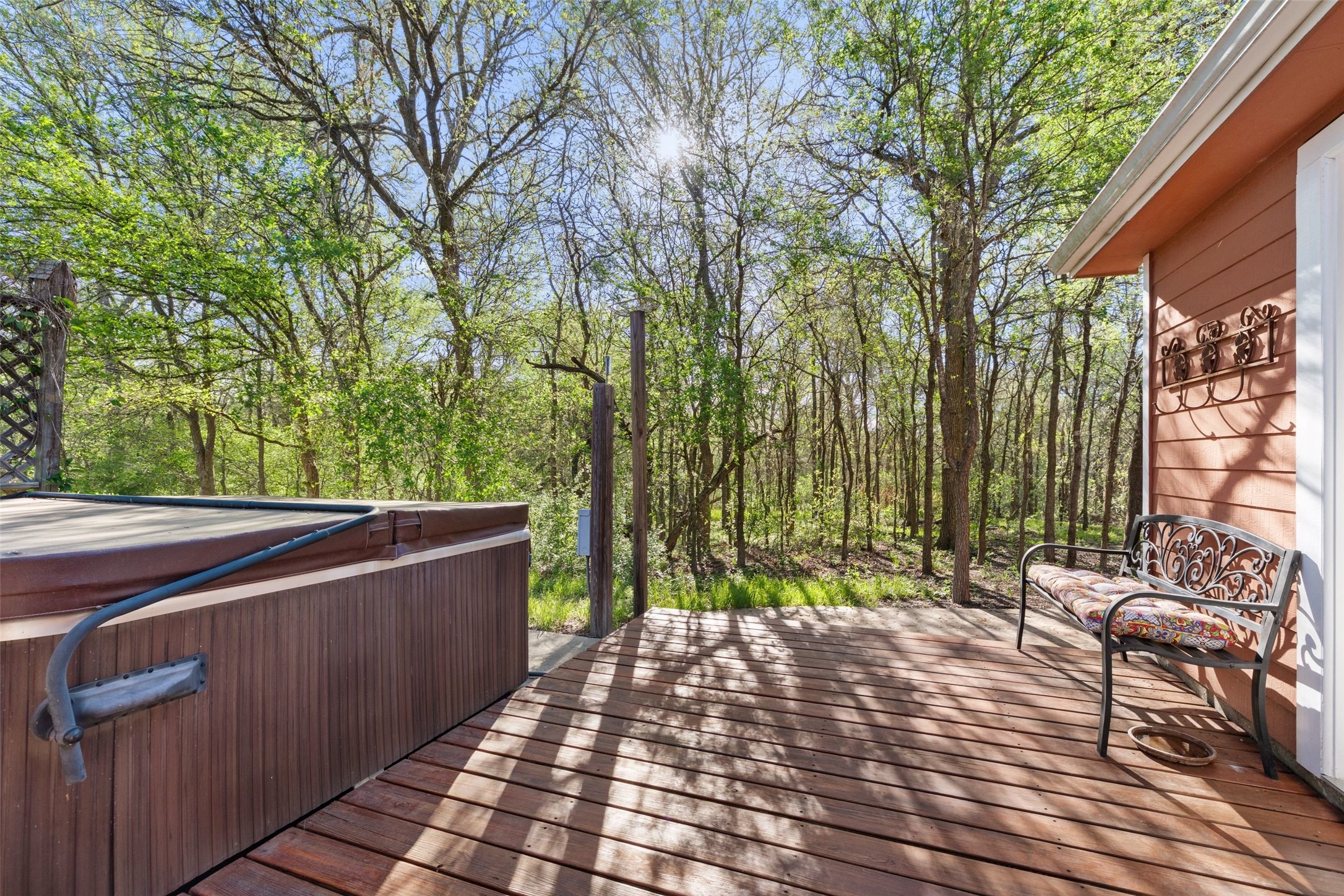 399 Upper Elgin River Road Elgin, TX 78621 - Photo 11 of 39 Deck with a hot tub