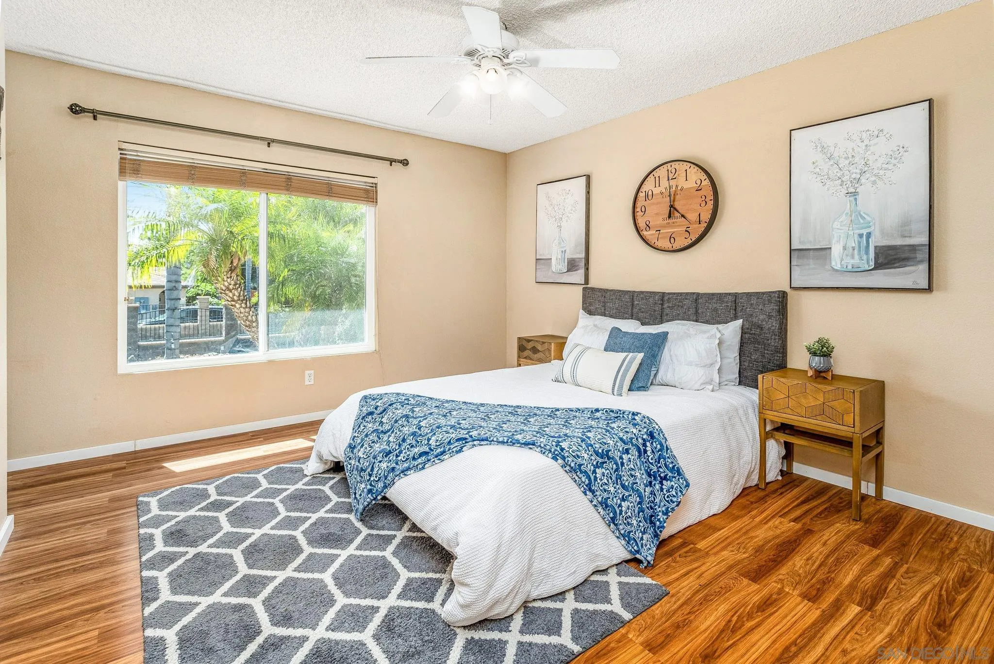 781 North Stage Coach Lane Fallbrook, CA 92028 - Photo 14 of 35 a bedroom with a bed and painting on the wall