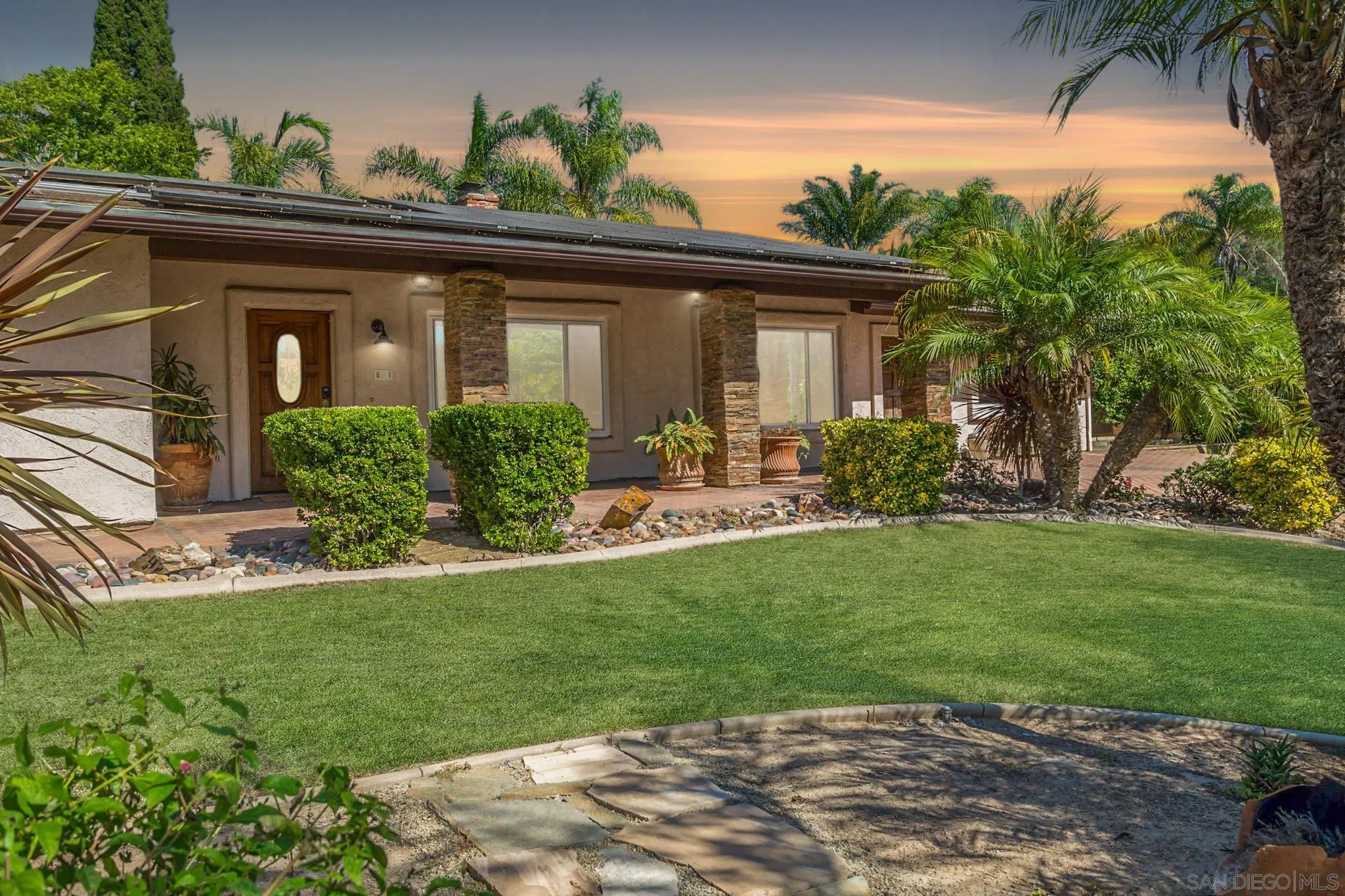 781 North Stage Coach Lane Fallbrook, CA 92028 - Photo 2 of 35 a front view of a house with a yard