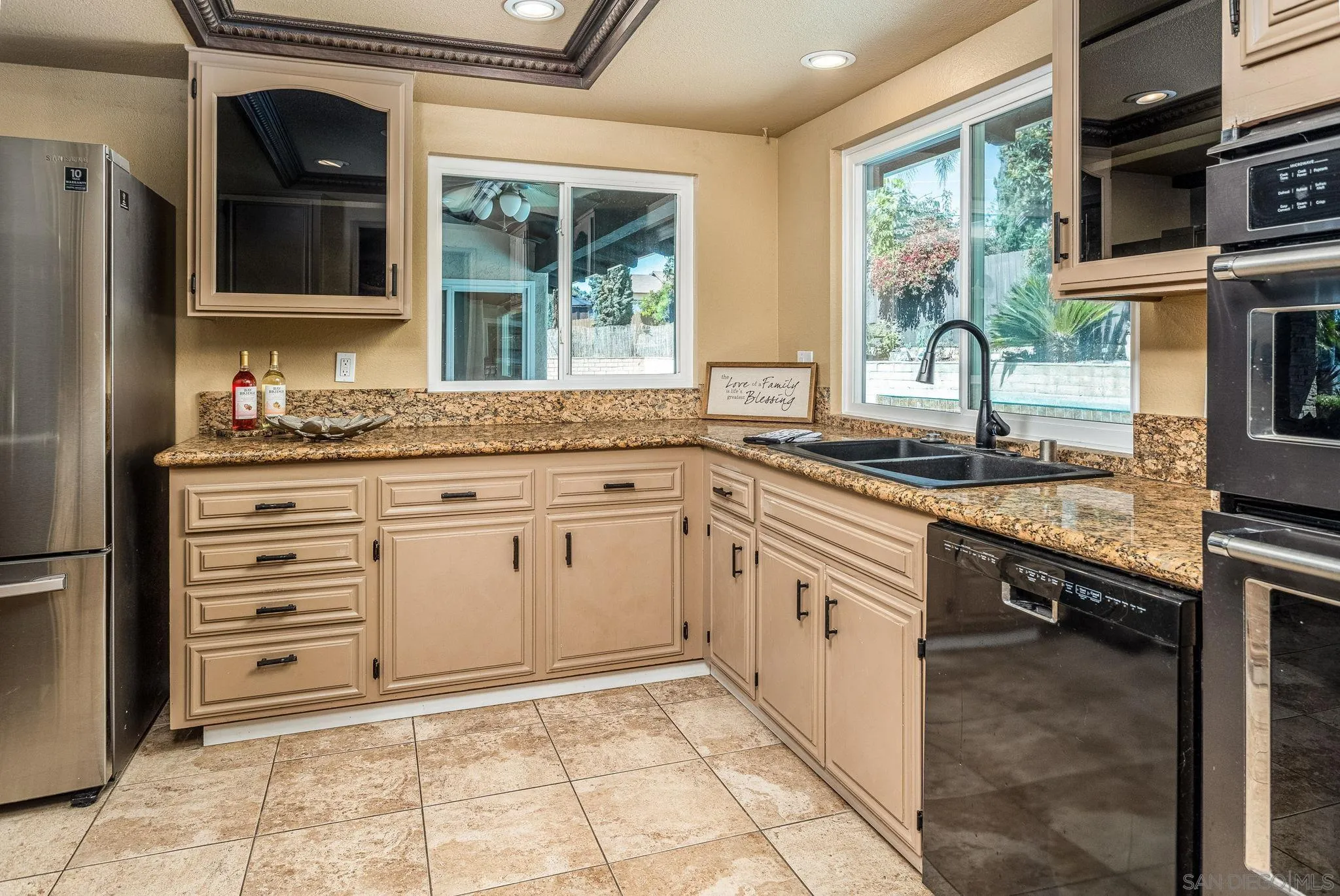 781 North Stage Coach Lane Fallbrook, CA 92028 - Photo 6 of 35 a kitchen with granite countertop a sink stove and cabinets