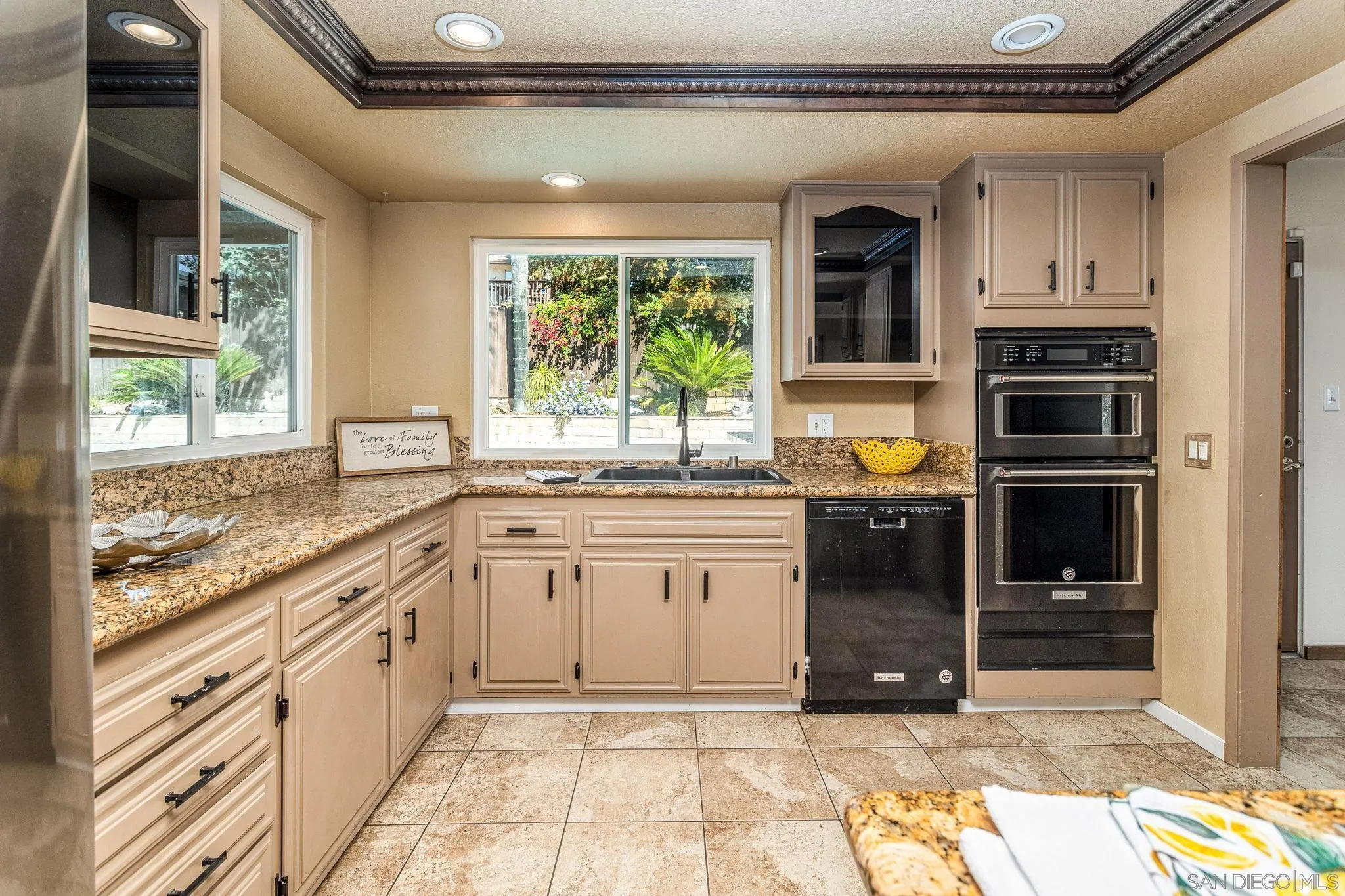 781 North Stage Coach Lane Fallbrook, CA 92028 - Photo 7 of 35 a kitchen with a sink stove and cabinets
