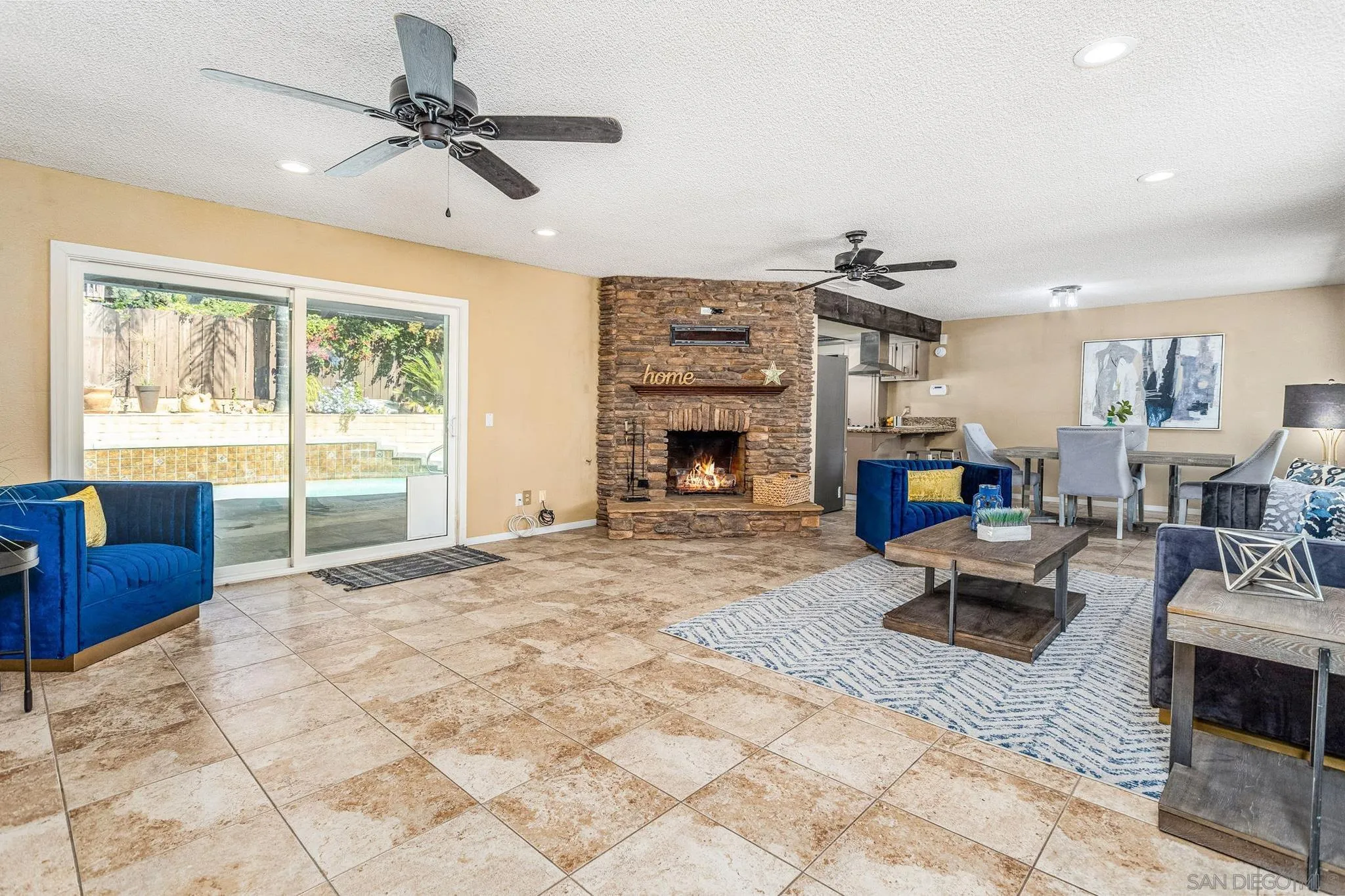 781 North Stage Coach Lane Fallbrook, CA 92028 - Photo 9 of 35 a living room with furniture large window and a fireplace