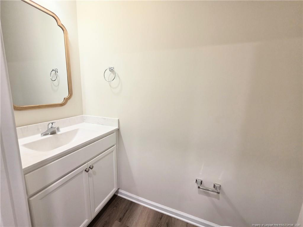 1511 Fort Bragg Road, Unit E Fayetteville, NC 28305 - Photo 14 of 15 a bathroom with a sink and a mirror