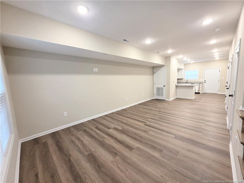 1511 Fort Bragg Road, Unit E Fayetteville, NC 28305 - Photo 3 of 15 a view of empty room with wooden floor