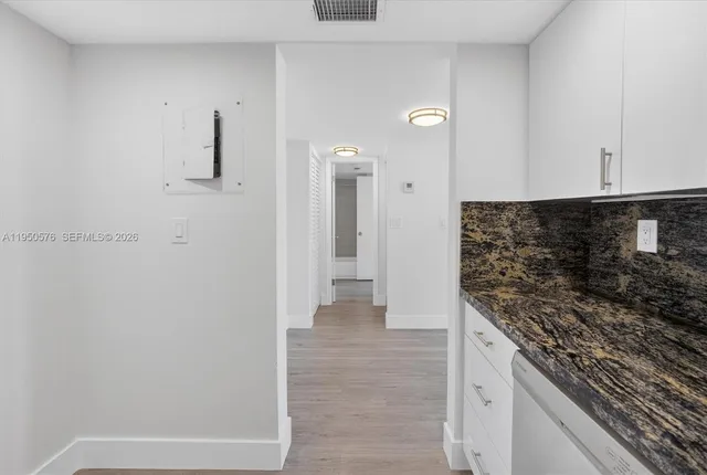 a view of a kitchen cabinets and a counter place