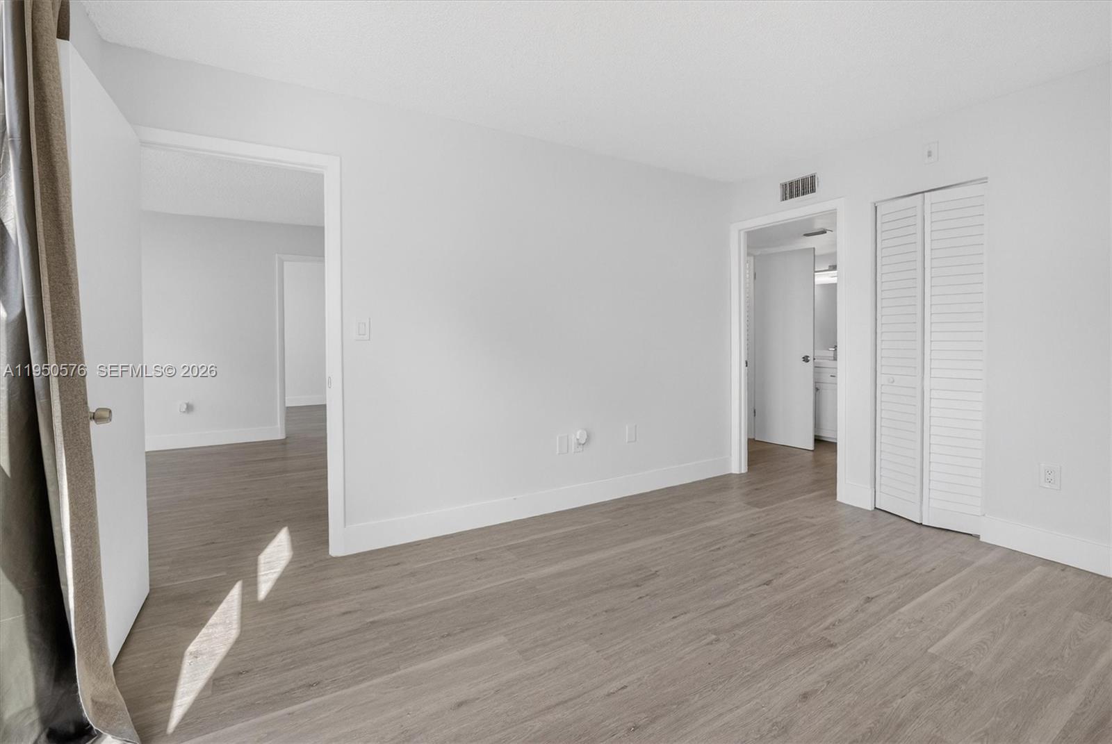 2075 Southwest 122nd Avenue, Unit 531 Miami, FL 33175 - Photo 17 of 27 wooden floor in an empty room