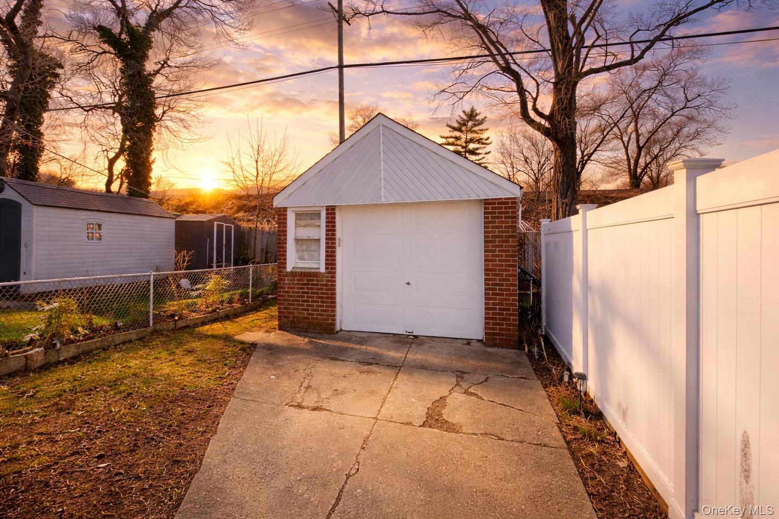 219-42 141st Road Queens, NY 11413 - Photo 9 of 23 front view of a house with a yard