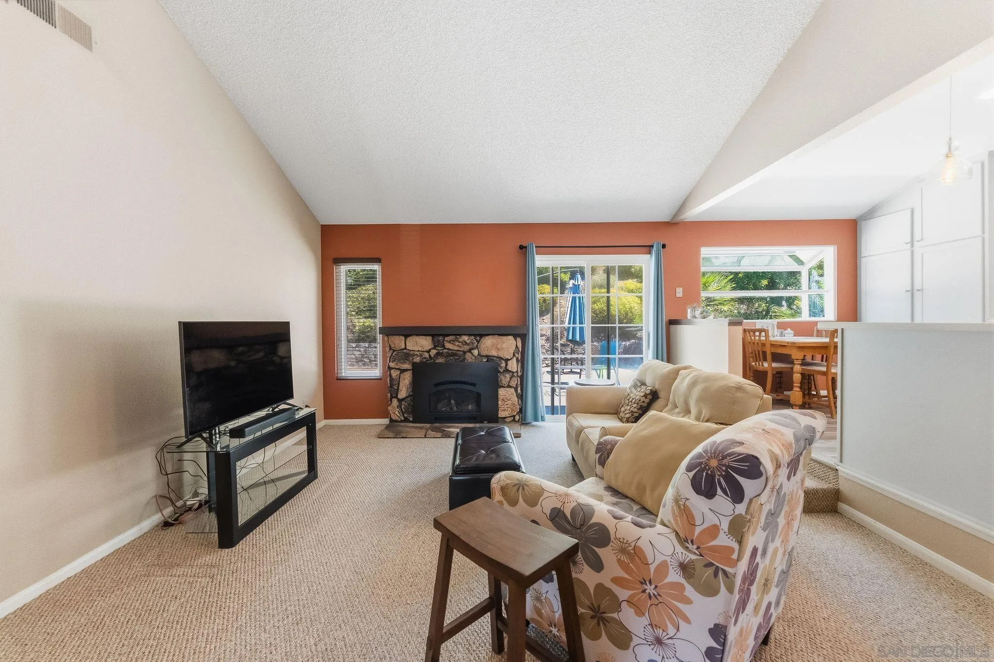 10565 Strathmore Drive Santee, CA 92071 - Photo 11 of 59 a living room with furniture tv and a flat screen tv