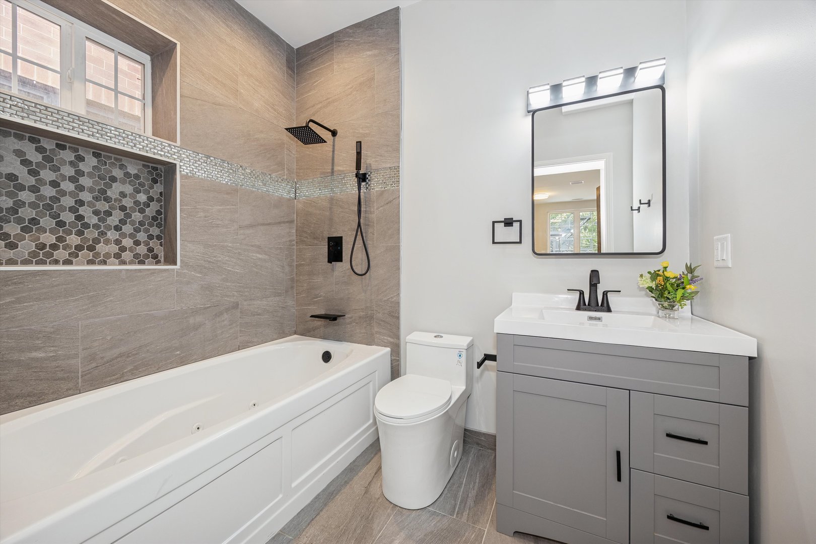 2008 West Addison Street, Unit 2 Chicago, IL 60618 - Photo 17 of 19 a bathroom with a sink a toilet and shower