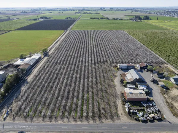 an aerial view of a house with a ocean view