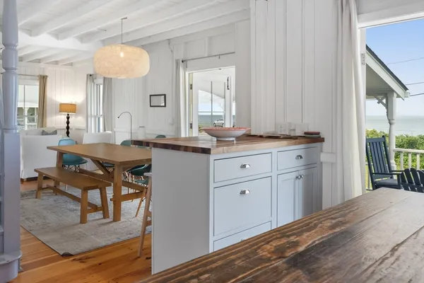 a view of a kitchen counter space and windows